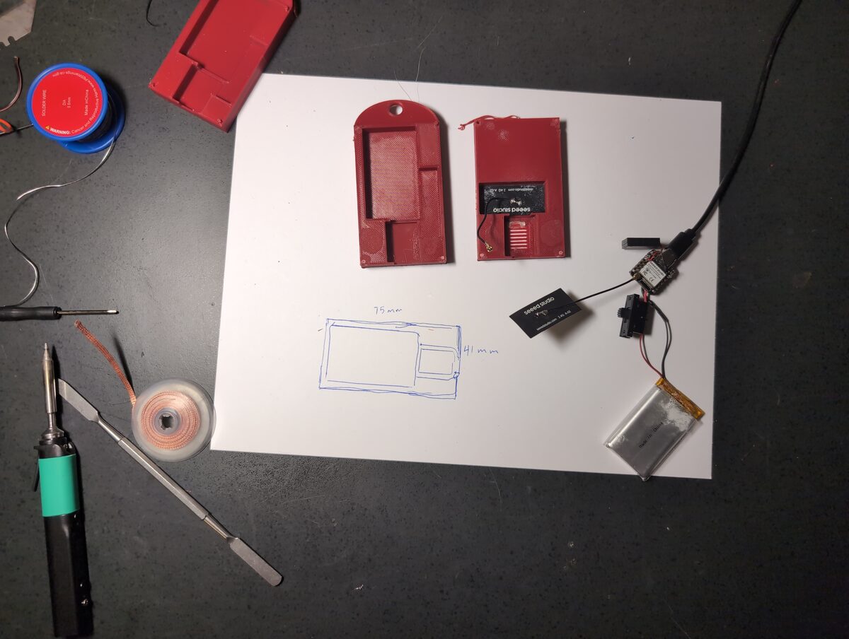 A red case opened up holding various electronics